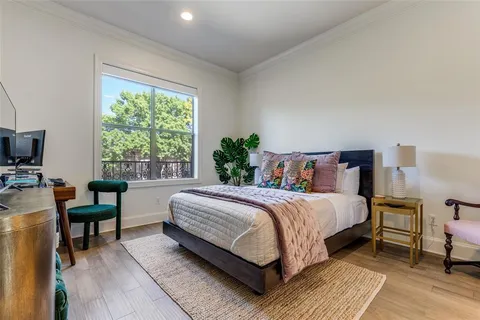 a bedroom with a bed and a desk