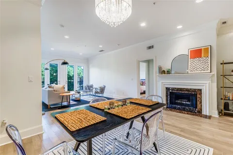 a living room with furniture a fireplace and a table