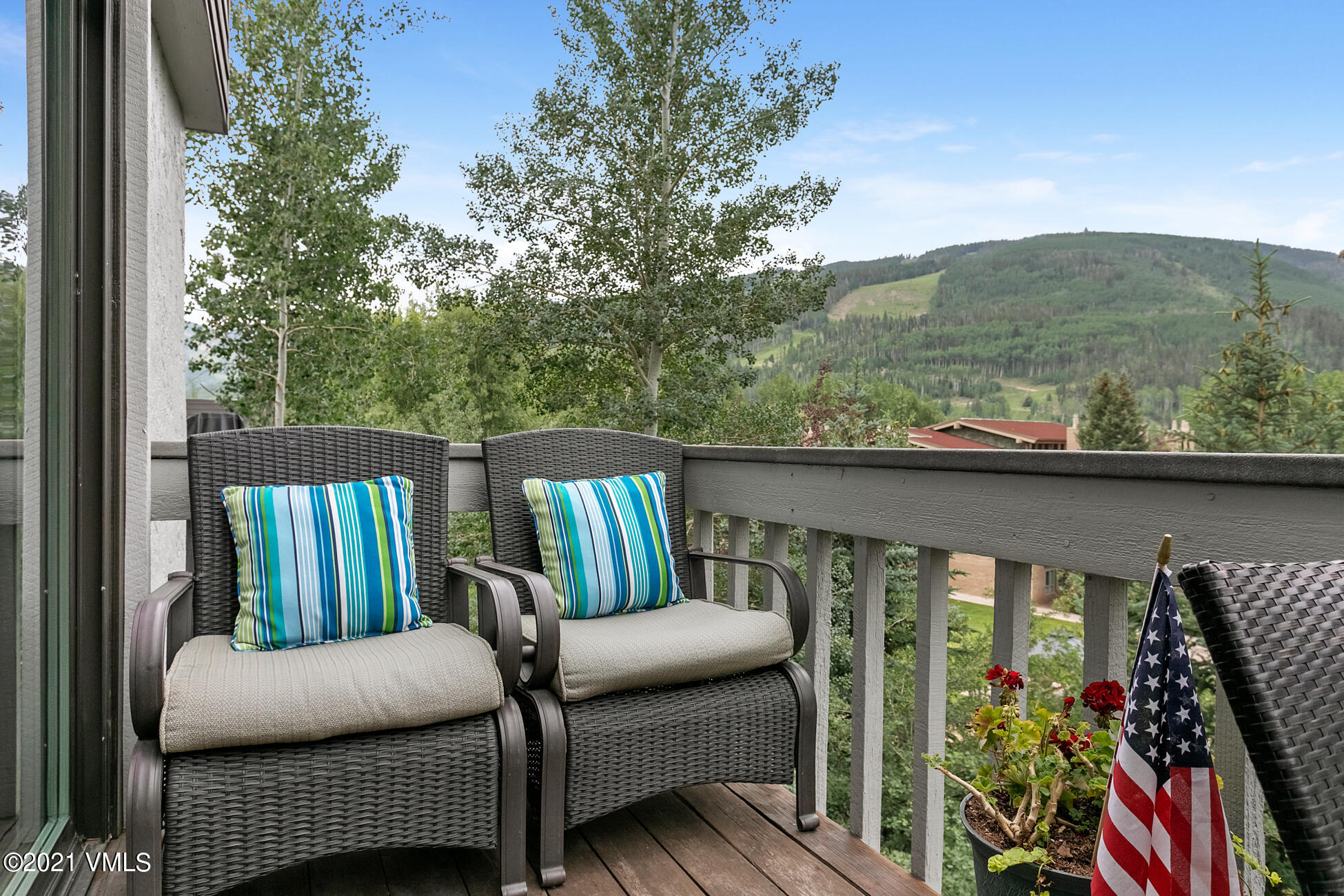 980 Vail View Drive, Unit 211B Vail, CO 81657 - Photo 19 of 21 a balcony view with couple of chairs and a couch