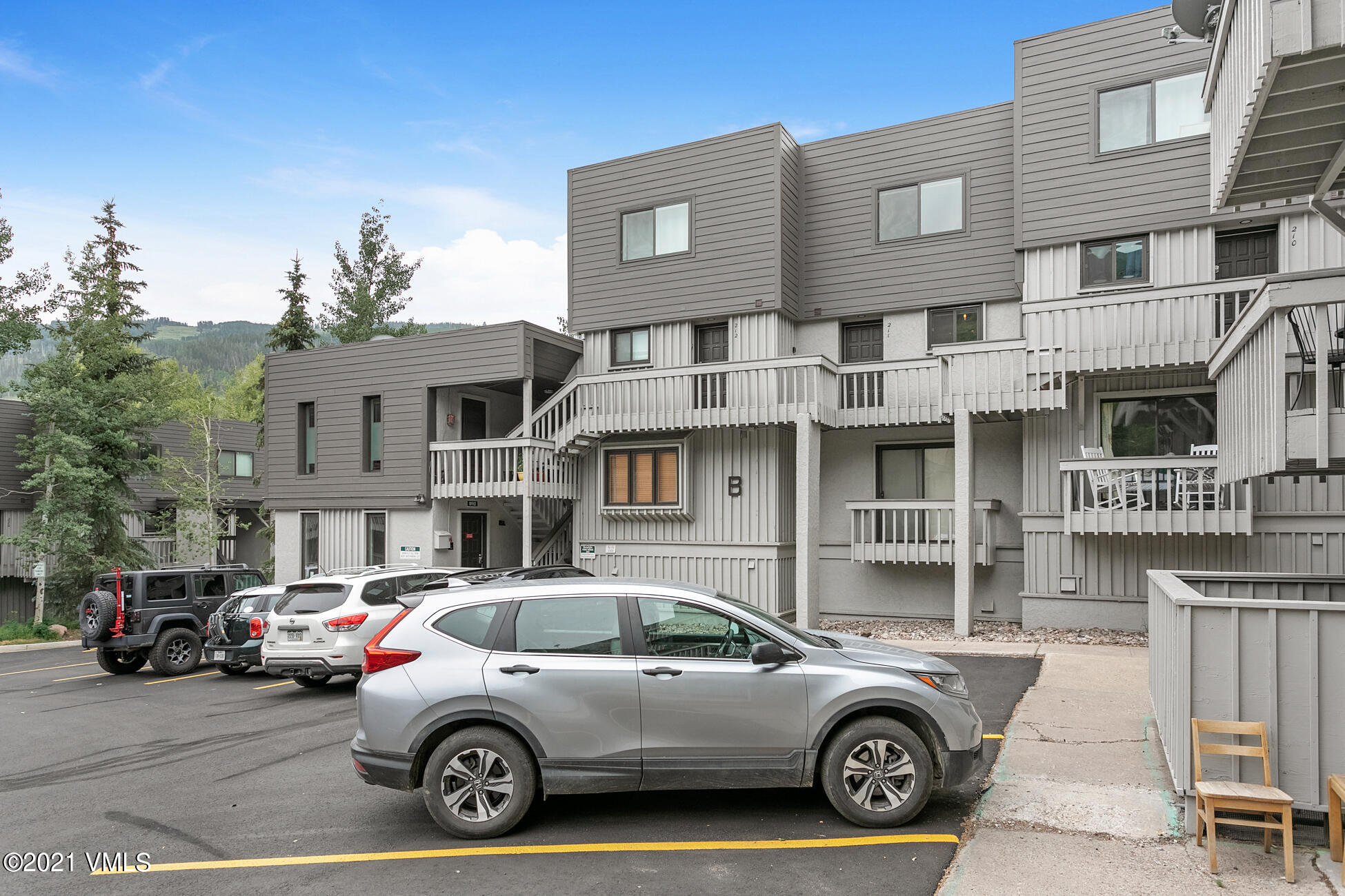 980 Vail View Drive, Unit 211B Vail, CO 81657 - Photo 21 of 21 a car parked in front of a large house