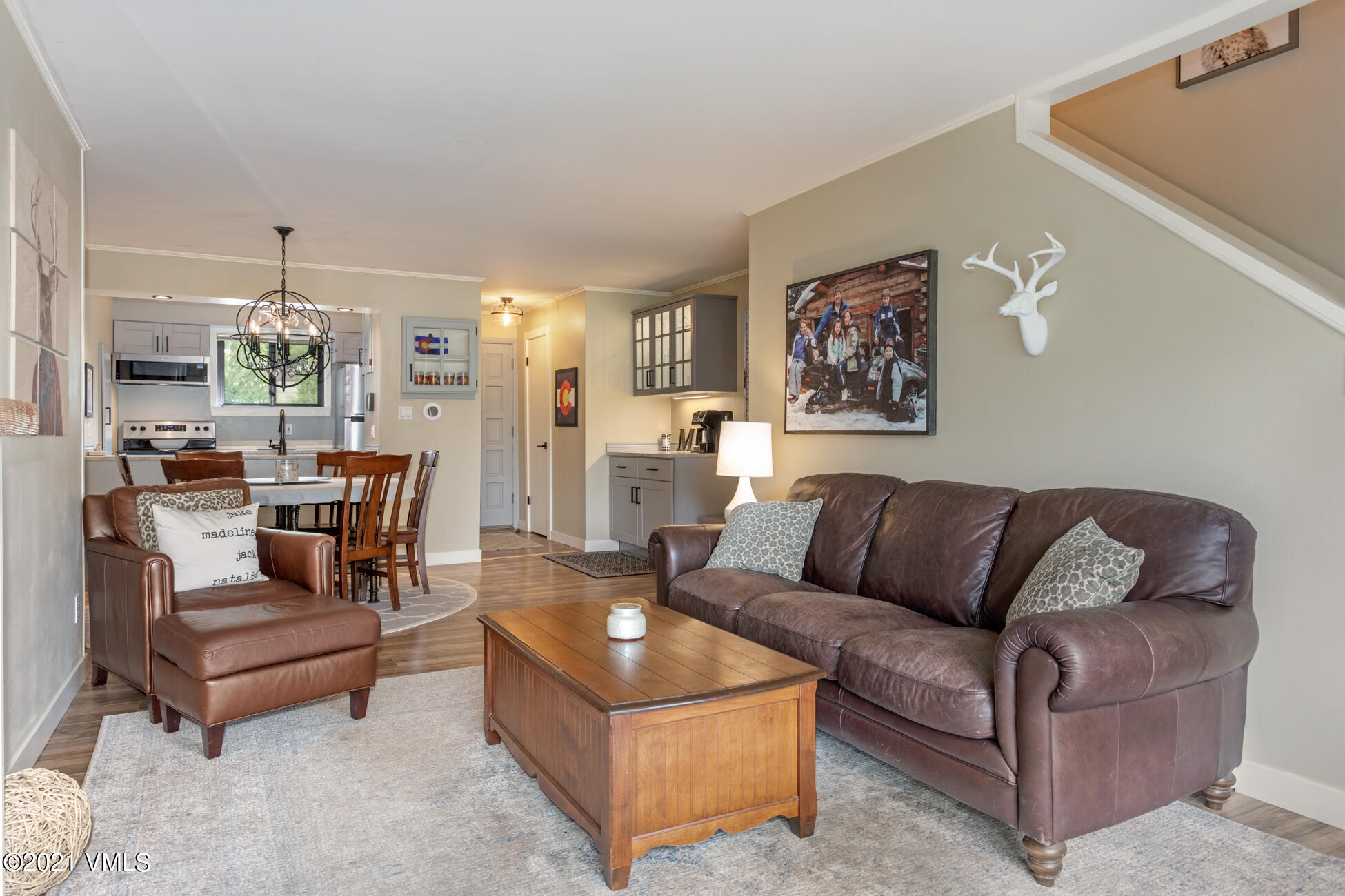 980 Vail View Drive, Unit 211B Vail, CO 81657 - Photo 10 of 21 a living room with furniture and a painting