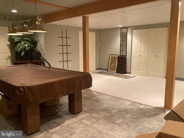 710 Fox Court Langhorne, PA 19047 - Photo 11 of 22 a living room with a table and chandelier