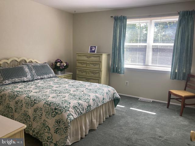 710 Fox Court Langhorne, PA 19047 - Photo 18 of 22 a bedroom with a bed and a window