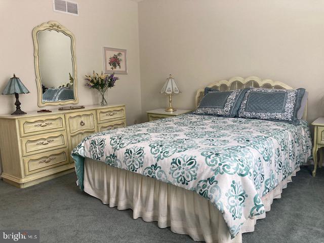 710 Fox Court Langhorne, PA 19047 - Photo 19 of 22 a bedroom with a bed and dresser with mirror