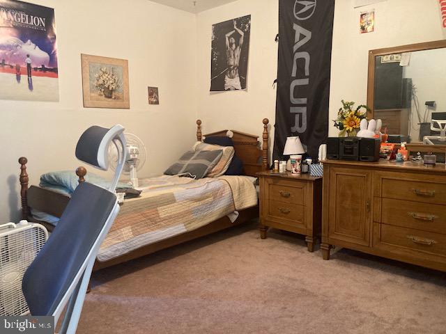 710 Fox Court Langhorne, PA 19047 - Photo 20 of 22 a bed room with a bed chair and wall painting