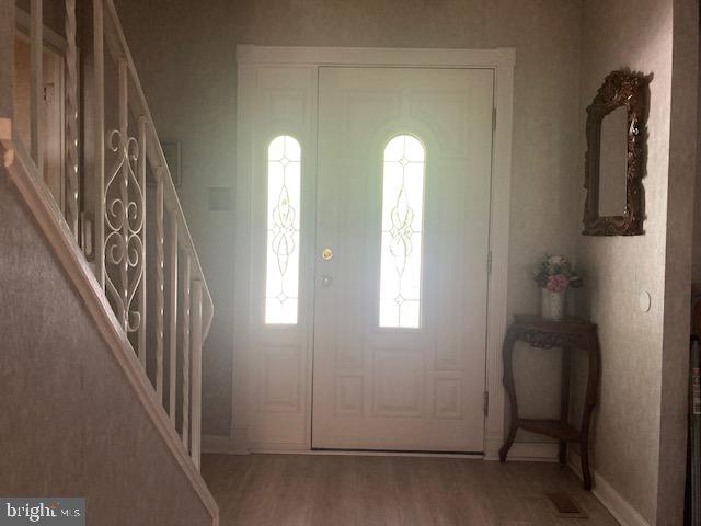 710 Fox Court Langhorne, PA 19047 - Photo 4 of 22 a view of a hallway with windows