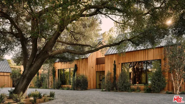 a view of a house with a tree