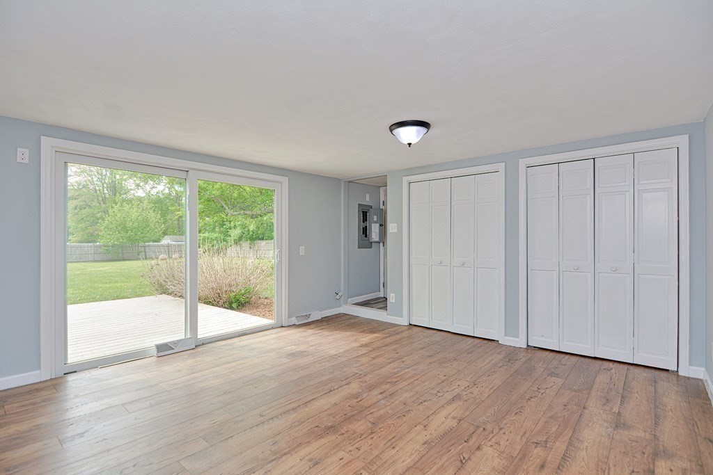 20 Alder Road Norton, MA 02766 - Photo 12 of 32 a view of an empty room with wooden floor and a window