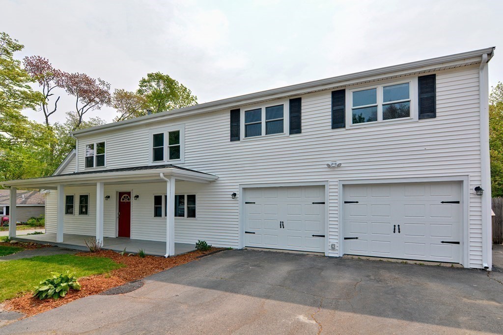 20 Alder Road Norton, MA 02766 - Photo 2 of 32 a front view of a house with a garden