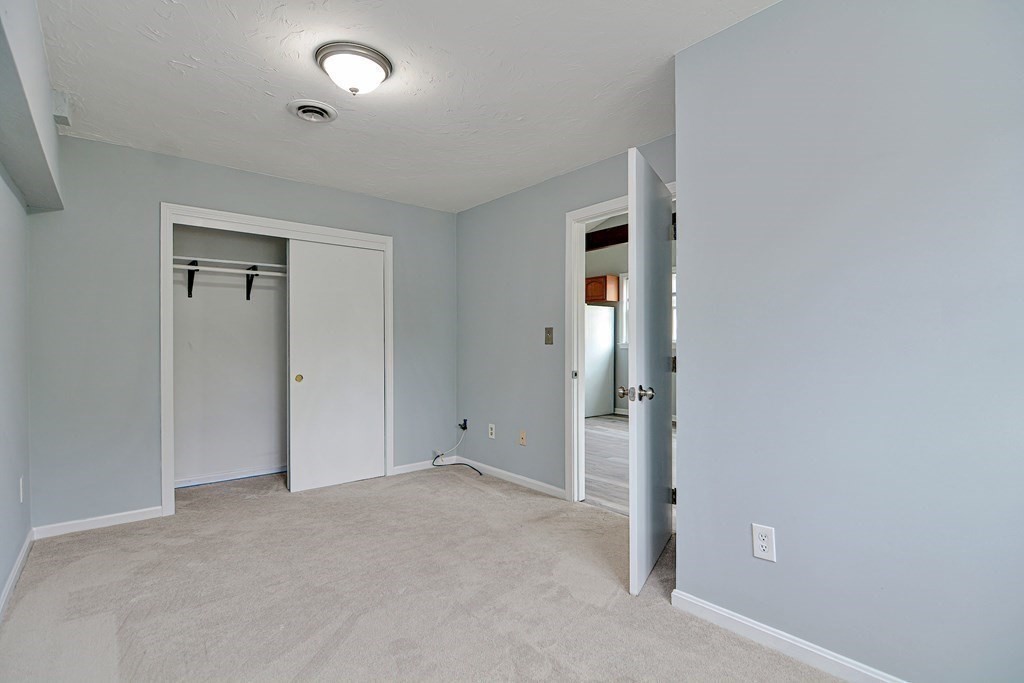 20 Alder Road Norton, MA 02766 - Photo 23 of 32 an empty room with closet and windows