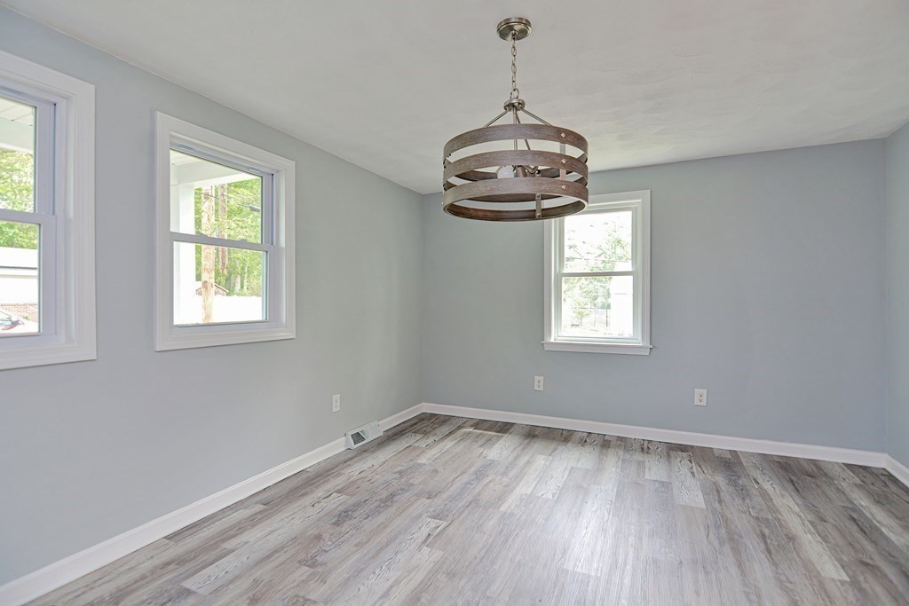 20 Alder Road Norton, MA 02766 - Photo 9 of 32 a view of empty room with wooden floor and window