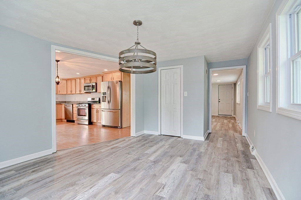 20 Alder Road Norton, MA 02766 - Photo 10 of 32 a view of a kitchen with a dishwasher cabinets and a wooden floor