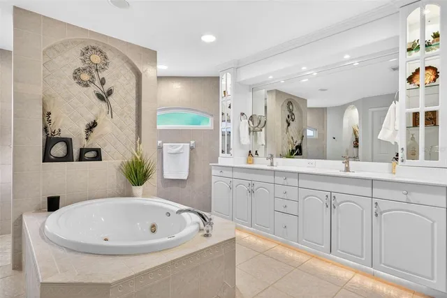 a bathroom with a sink a bathtub and a mirror