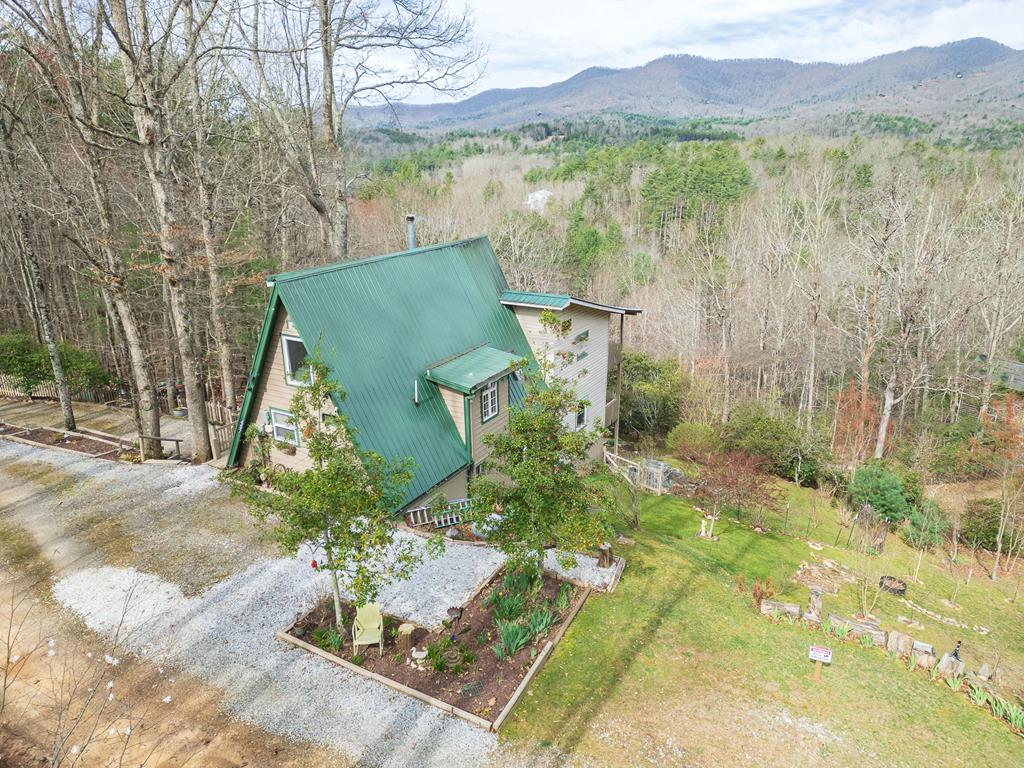 457 Persimmon Hts Road Murphy, NC 28906 - Photo 1 of 42 a view of a lake with a mountain in the background