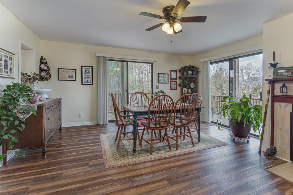 457 Persimmon Hts Road Murphy, NC 28906 - Photo 12 of 42 a view of a dining room with furniture and wooden floor