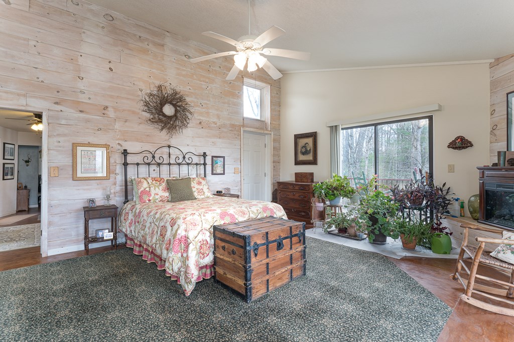 457 Persimmon Hts Road Murphy, NC 28906 - Photo 23 of 42 a bed sitting in a spacious bedroom next to a window
