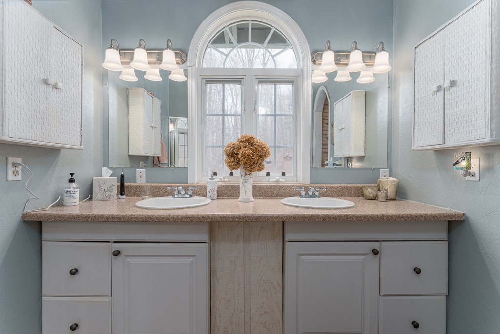 457 Persimmon Hts Road Murphy, NC 28906 - Photo 29 of 42 a bathroom with a sink and a mirror