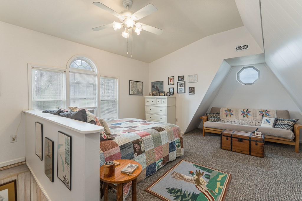 457 Persimmon Hts Road Murphy, NC 28906 - Photo 34 of 42 a living room with furniture and a chandelier
