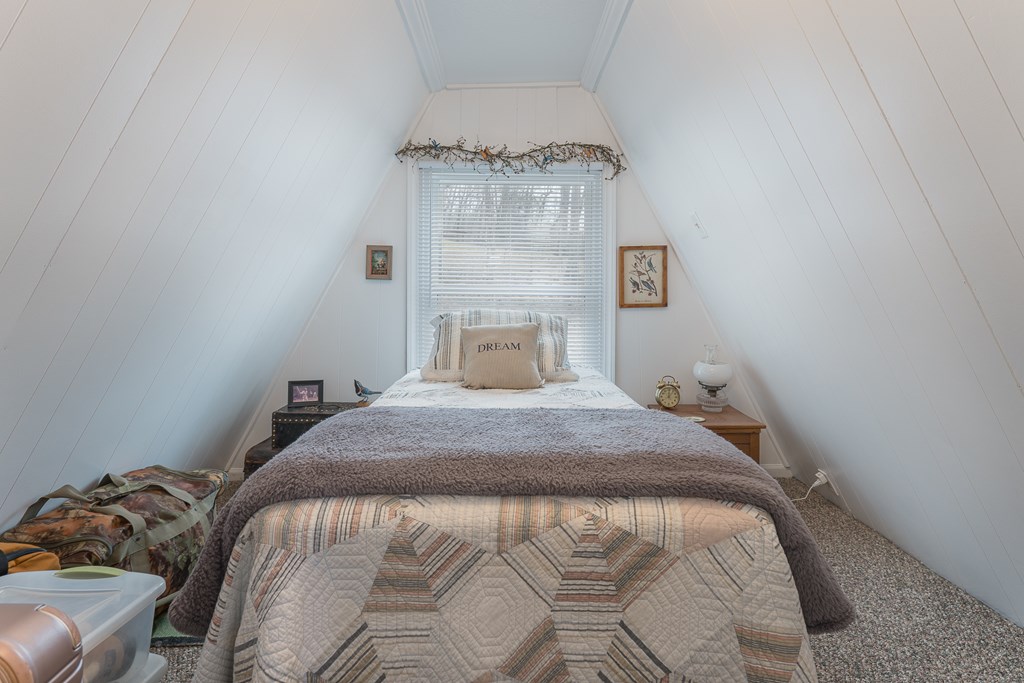 457 Persimmon Hts Road Murphy, NC 28906 - Photo 36 of 42 a bedroom with a bed and a mirror