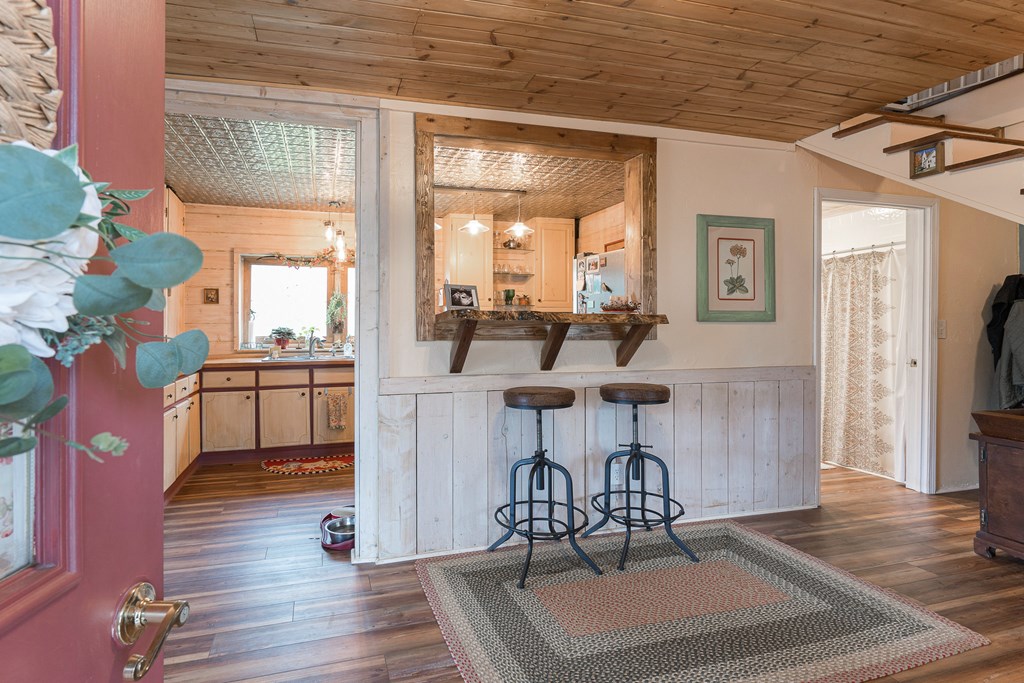 457 Persimmon Hts Road Murphy, NC 28906 - Photo 5 of 42 a view of a dining room with furniture a chandelier and wooden floor