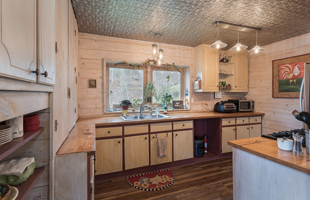 457 Persimmon Hts Road Murphy, NC 28906 - Photo 6 of 42 a kitchen with stainless steel appliances granite countertop a stove a sink and a refrigerator