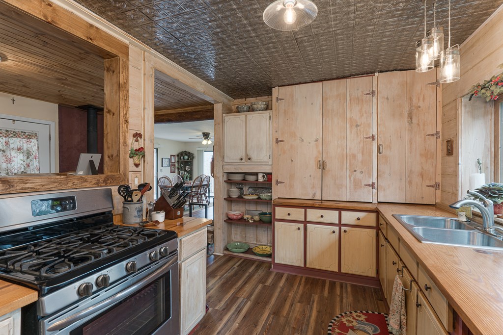 457 Persimmon Hts Road Murphy, NC 28906 - Photo 9 of 42 a kitchen with stainless steel appliances granite countertop a stove and a sink