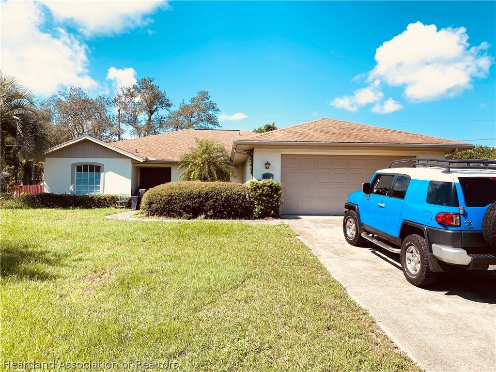248 Tangerine Road Lake Placid, FL 33852 - Photo 16 of 16 a house view with a garden space