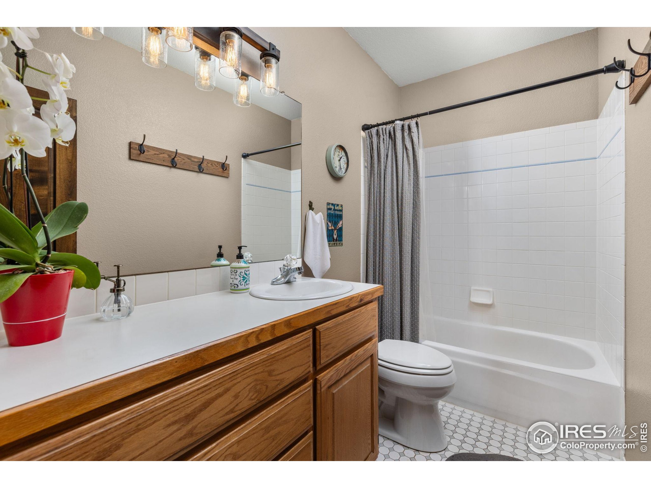 681 Bitterroot Gulch Road Loveland, CO 80537 - Photo 26 of 47 a bathroom with a sink a toilet and shower
