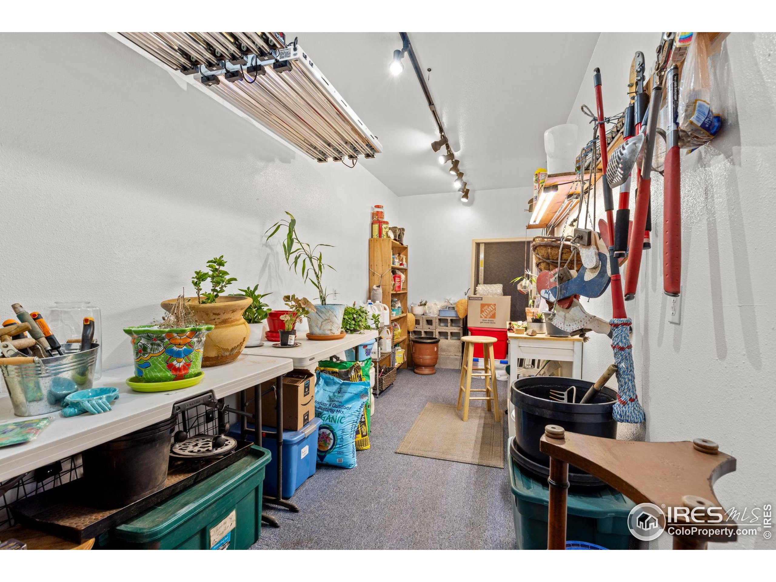 681 Bitterroot Gulch Road Loveland, CO 80537 - Photo 29 of 47 a room with lots of wooden furniture and clutter
