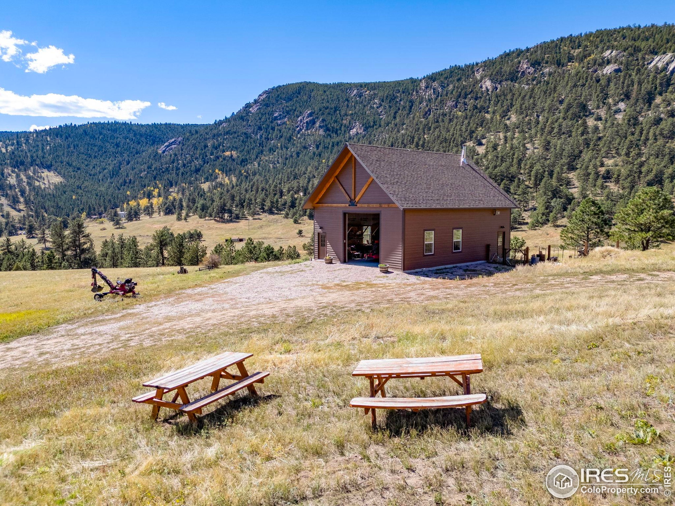 681 Bitterroot Gulch Road Loveland, CO 80537 - Photo 35 of 47 a swimming pool with mountain view