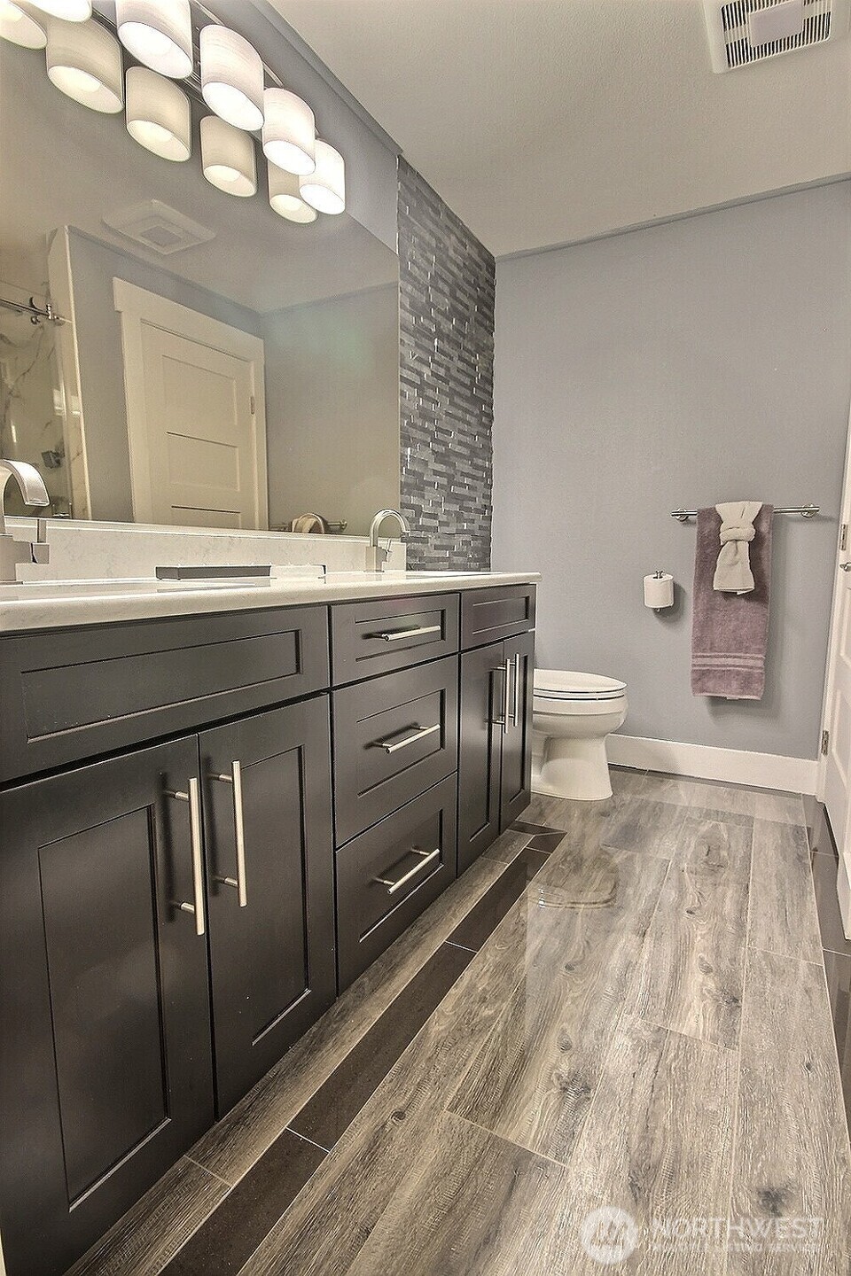 5409 South 237th Place, Unit 164 Kent, WA 98032 - Photo 12 of 25 a spacious bathroom with a sink a toilet and a mirror