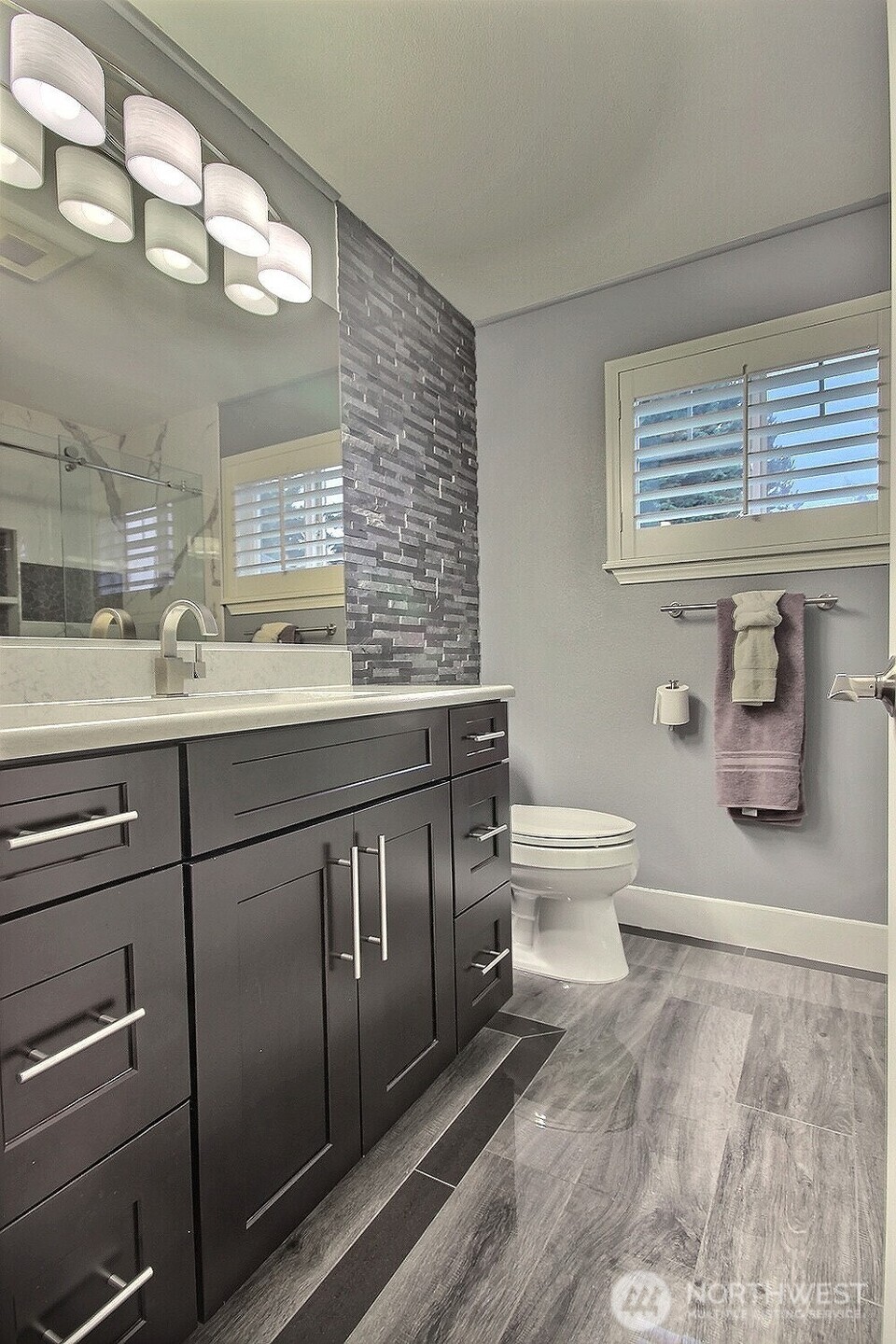 5409 South 237th Place, Unit 164 Kent, WA 98032 - Photo 18 of 25 a bathroom with a granite countertop toilet sink and mirror
