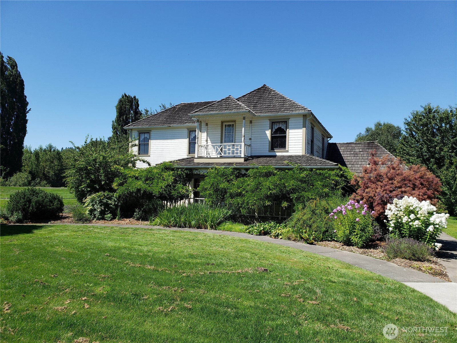 5409 South 237th Place, Unit 164 Kent, WA 98032 - Photo 22 of 25 a front view of a house with a yard