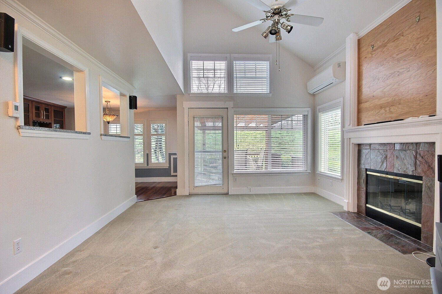 5409 South 237th Place, Unit 164 Kent, WA 98032 - Photo 6 of 25 a view of an empty room with a fireplace and a window