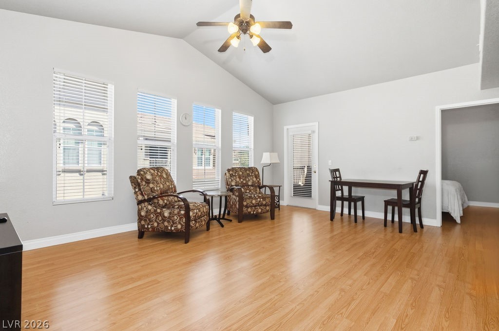 10550 West Alexander Road, Unit 2133 Las Vegas, NV 89129 - Photo 10 of 42 Wide-angle view of the living room looking toward the dining area.
