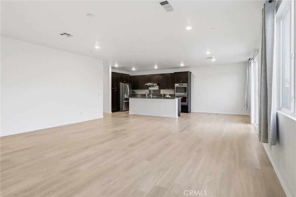 19452 Fortunello Avenue Riverside, CA 92508 - Photo 4 of 25 Family Room/Kitchen