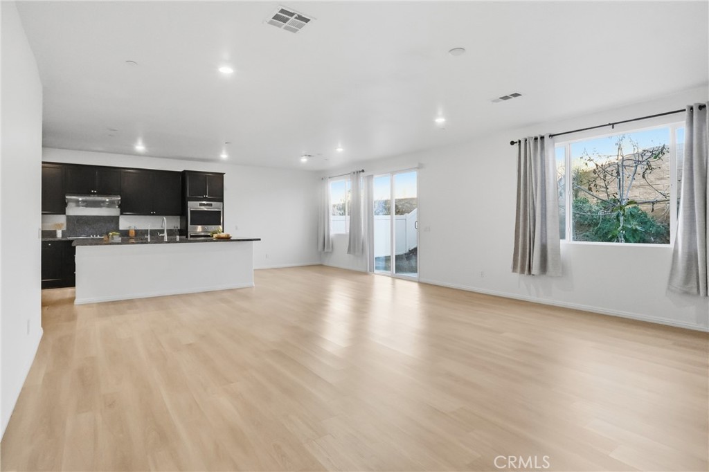 19452 Fortunello Avenue Riverside, CA 92508 - Photo 5 of 25 Family Room/Kitchen