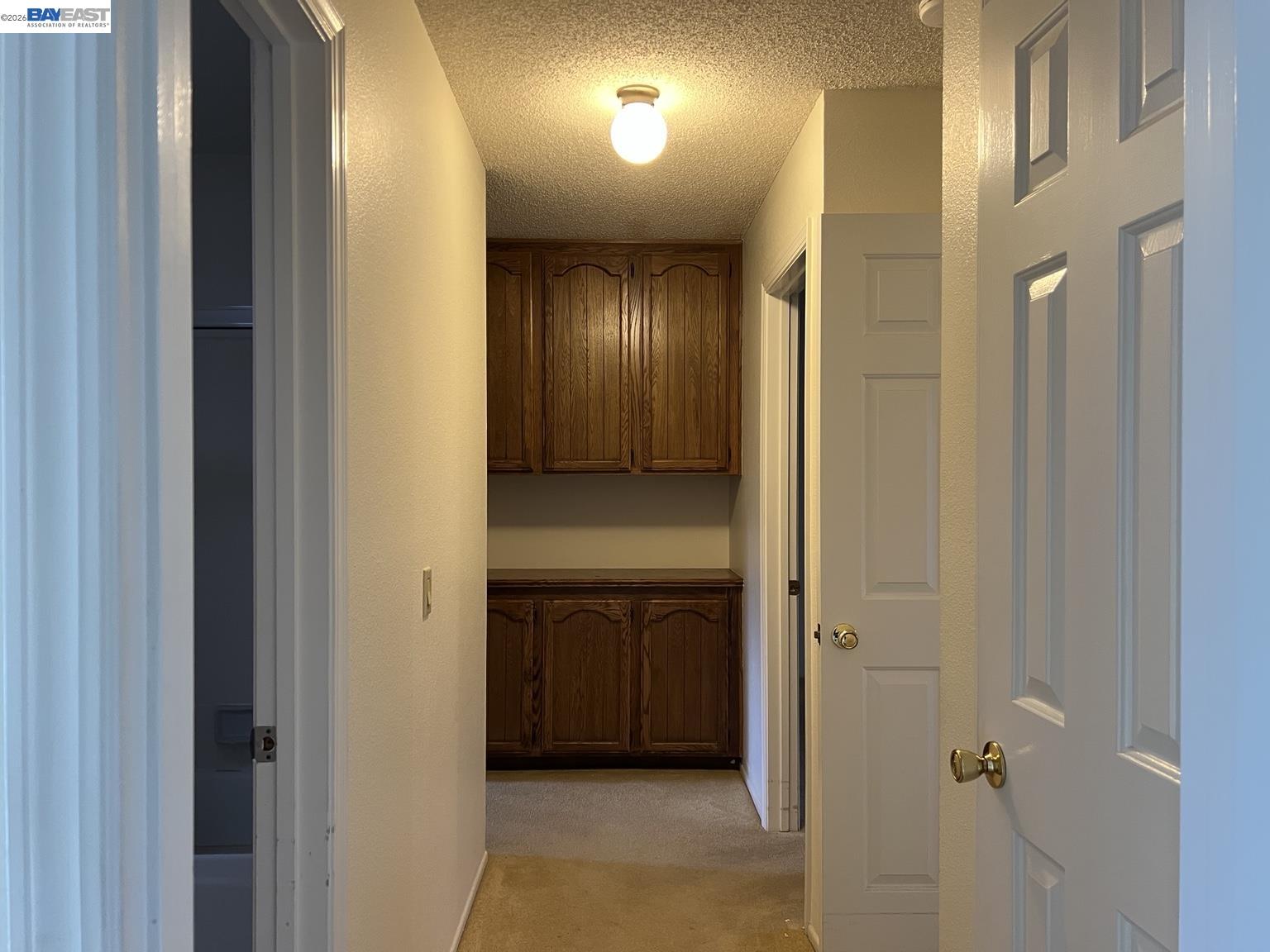 212 Puddingstone Road Alameda, CA 94502 - Photo 10 of 24 a view of a hallway with a door