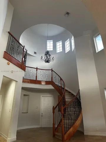 a view of entryway livingroom and hallway with wooden floor