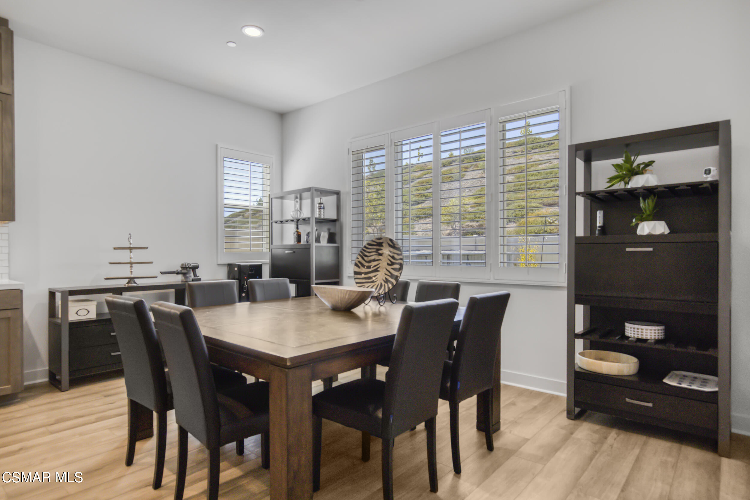 28665 Windbreak Trail Saugus, CA 91350 - Photo 11 of 56 a view of a dining room with furniture and wooden floor