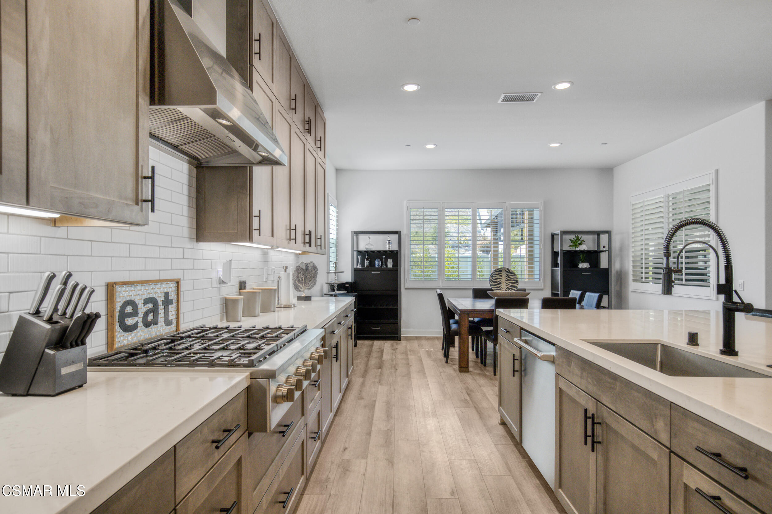 28665 Windbreak Trail Saugus, CA 91350 - Photo 15 of 56 a kitchen with sink stove and cabinets