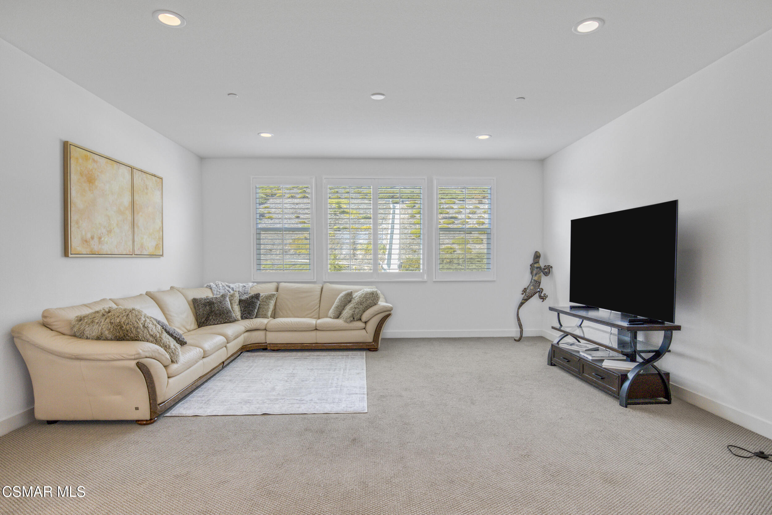 28665 Windbreak Trail Saugus, CA 91350 - Photo 20 of 56 a living room with furniture and a flat screen tv
