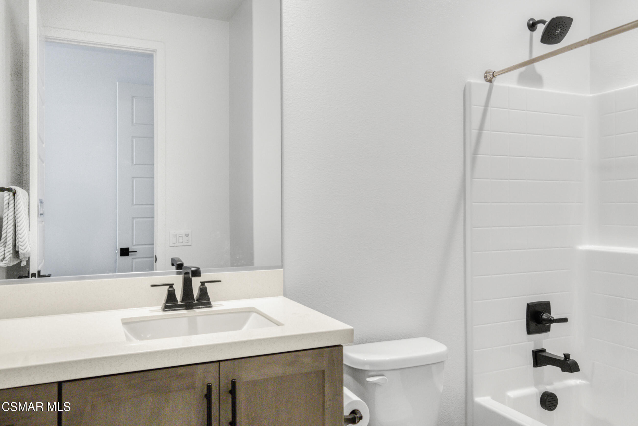 28665 Windbreak Trail Saugus, CA 91350 - Photo 29 of 56 a bathroom with a sink a toilet and shower