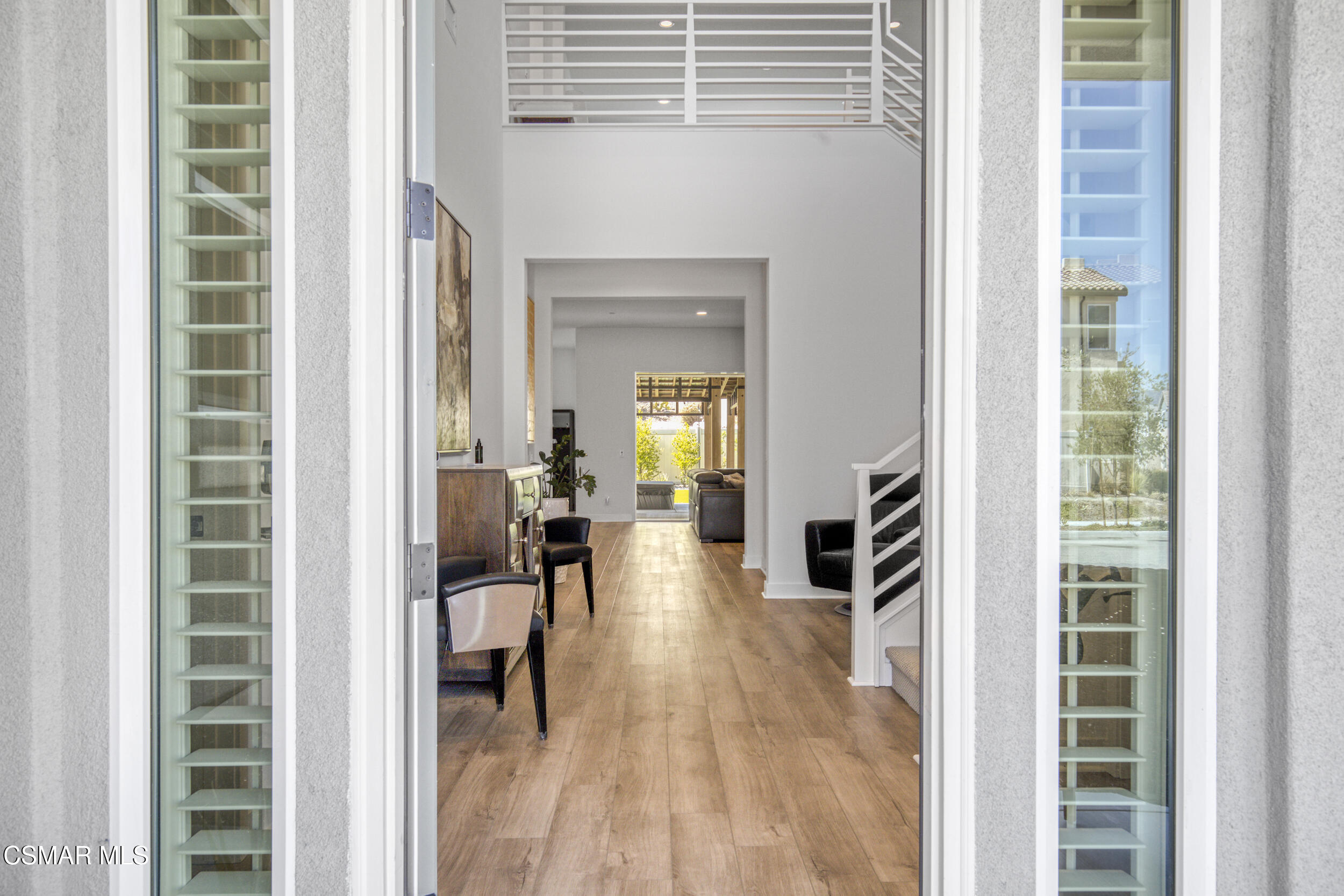 28665 Windbreak Trail Saugus, CA 91350 - Photo 3 of 56 a view of a hallway with living room and dining room