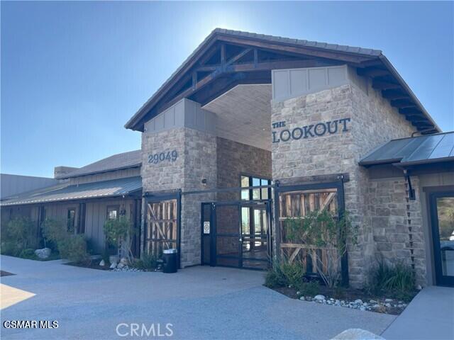 28665 Windbreak Trail Saugus, CA 91350 - Photo 41 of 56 a view of a house with entryway and a yard