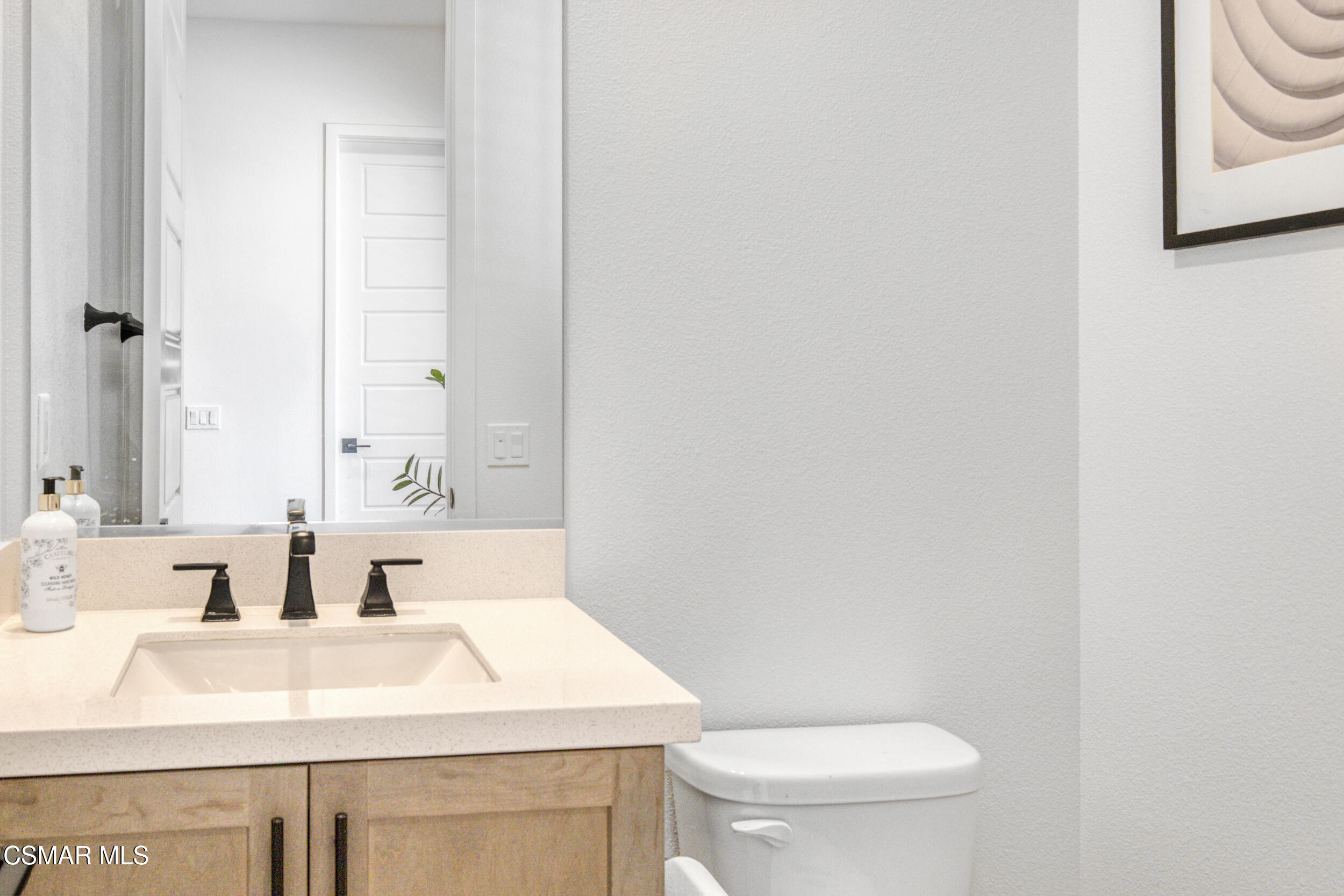 28665 Windbreak Trail Saugus, CA 91350 - Photo 5 of 56 a bathroom with a sink and a toilet