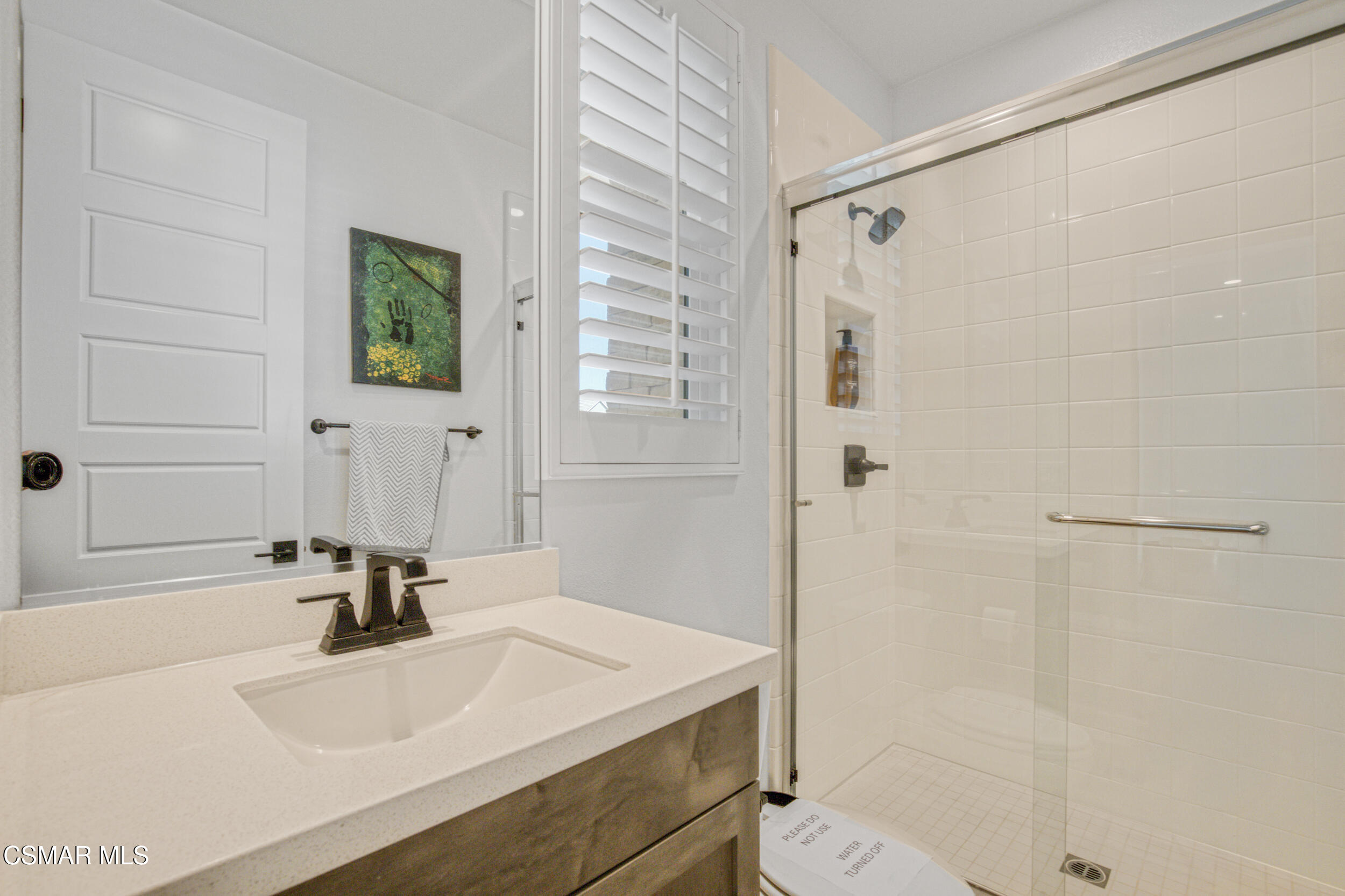 28665 Windbreak Trail Saugus, CA 91350 - Photo 9 of 56 a bathroom with a sink and a mirror