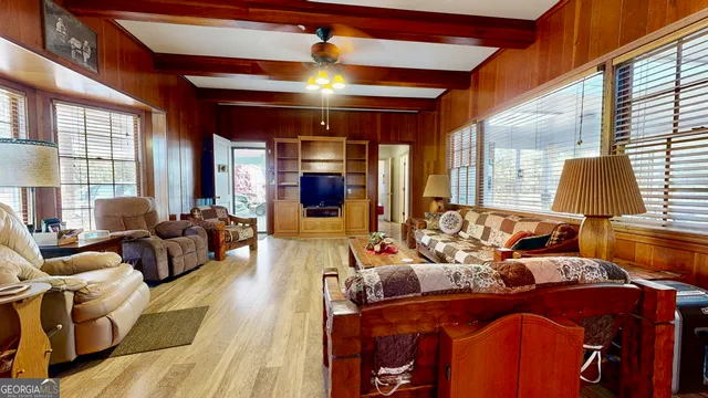 a living room filled with furniture window and wooden floor