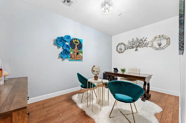 a kitchen with a stove a sink and a refrigerator