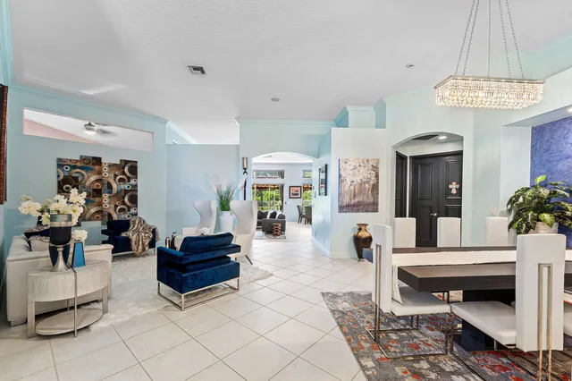 a large kitchen with a table and chairs in it